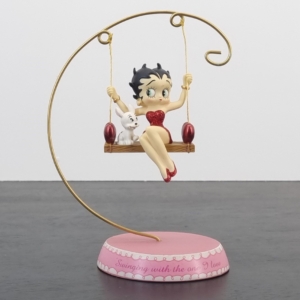 Vintage statue of Betty Boop on a swing with Pugsley