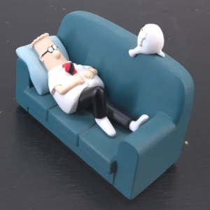 Dilbert and Dogbert sofa figurine with Dilbert lying on a blue couch