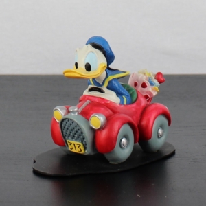 Donald Duck racing to Daisy Duck figurine