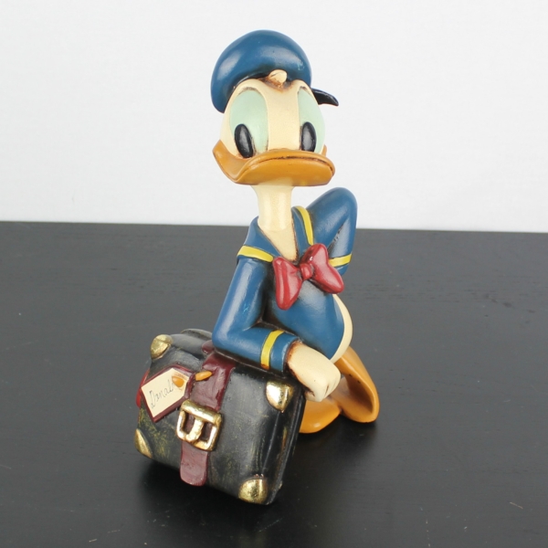 Donald Duck relaxing on his suitcase statue _medium version - Donald Duck relaxing on his suitcase statue