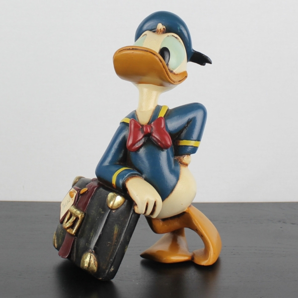 Donald Duck relaxing on his suitcase statue _medium version _front - Donald Duck relaxing on his suitcase statue _medium version _front