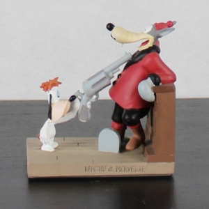 Droopy holding a gun to Wolf figurine