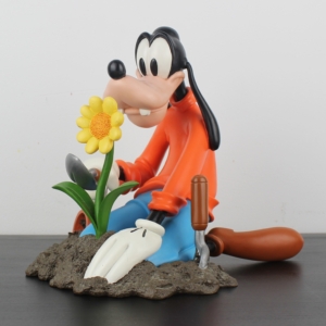 Goofy gardening statue
