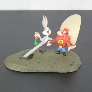 Yosemite Sam with Bugs Bunny statue by Atlas in license of Warner Bros.