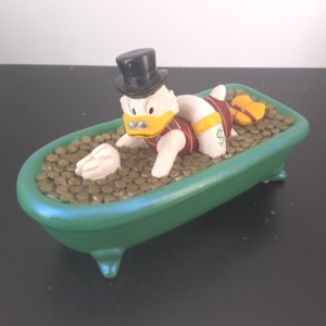 Statue of Scrooge McDuck swiming in money