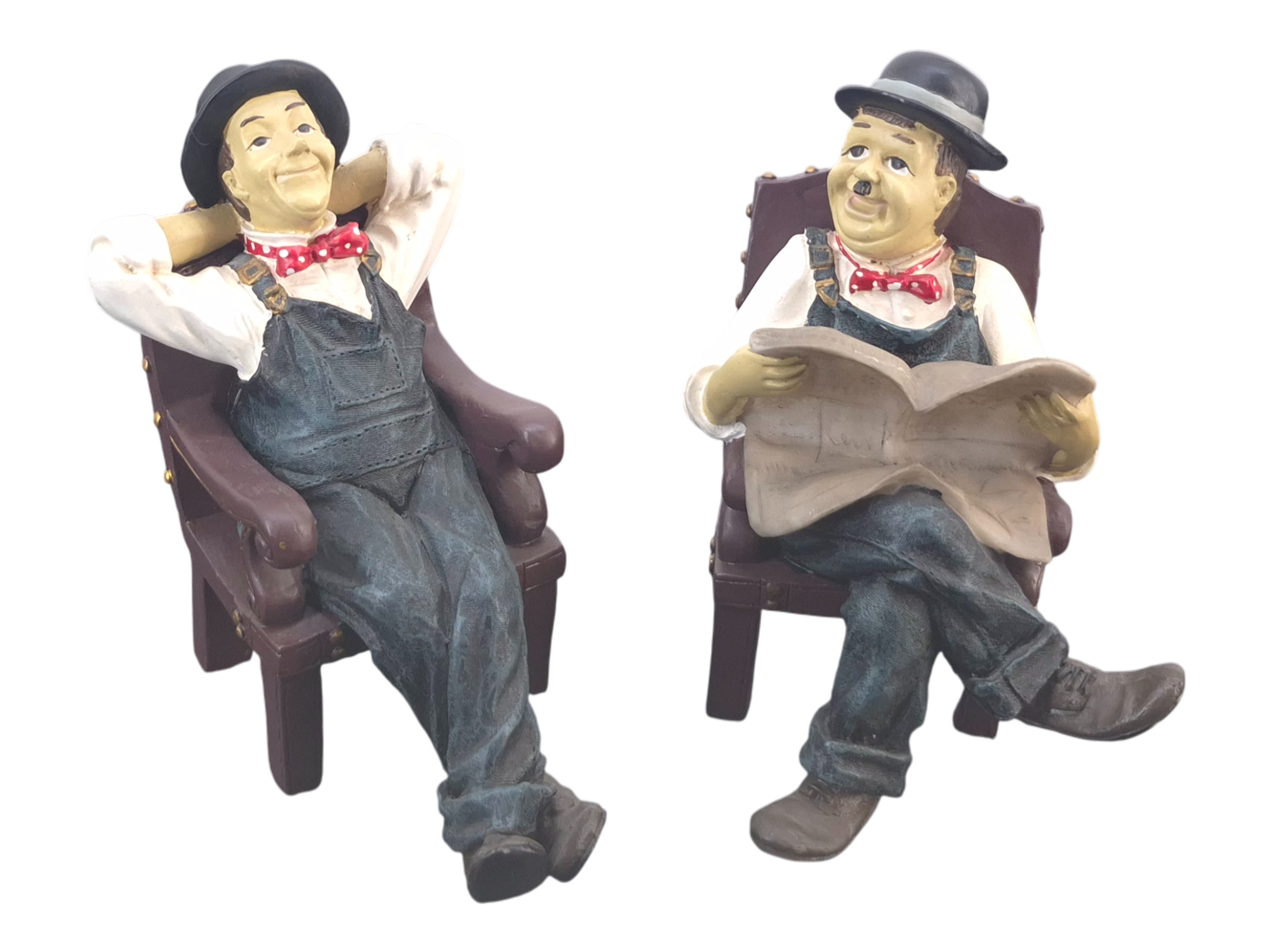 Laurel and Hardy seated statues Stan Laurel relaxing and Oliver Hardy reading newspaper vintage licensed collectible figurines