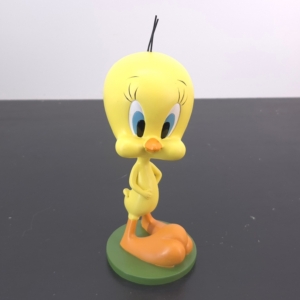 Tweety Bird figurine standing on a green base