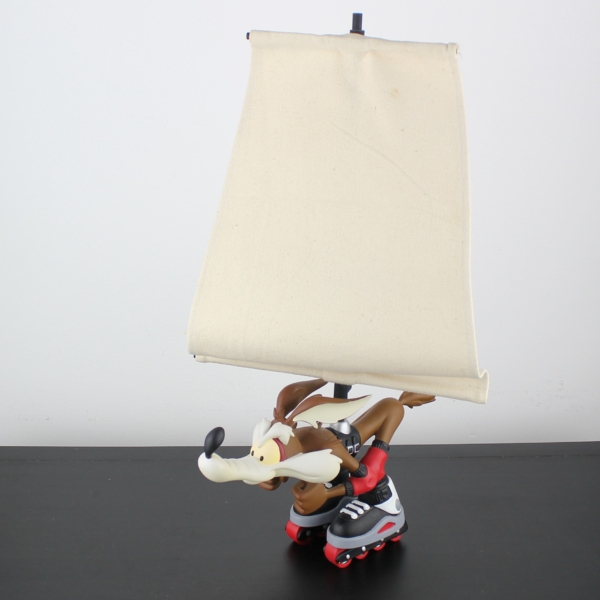 Wile E Coyote on skates with a giant windbreak - Wile E Coyote on skates with a giant windbreak