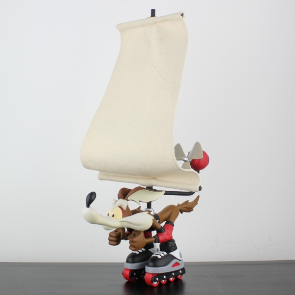 Wile E Coyote on skates with a giant windbreak _left front - Wile E Coyote on skates with a giant windbreak _left front