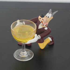 Wolf holding a champagne glass figurine